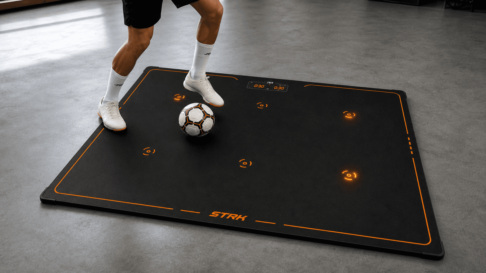 STRK football training mat with ball and light targets