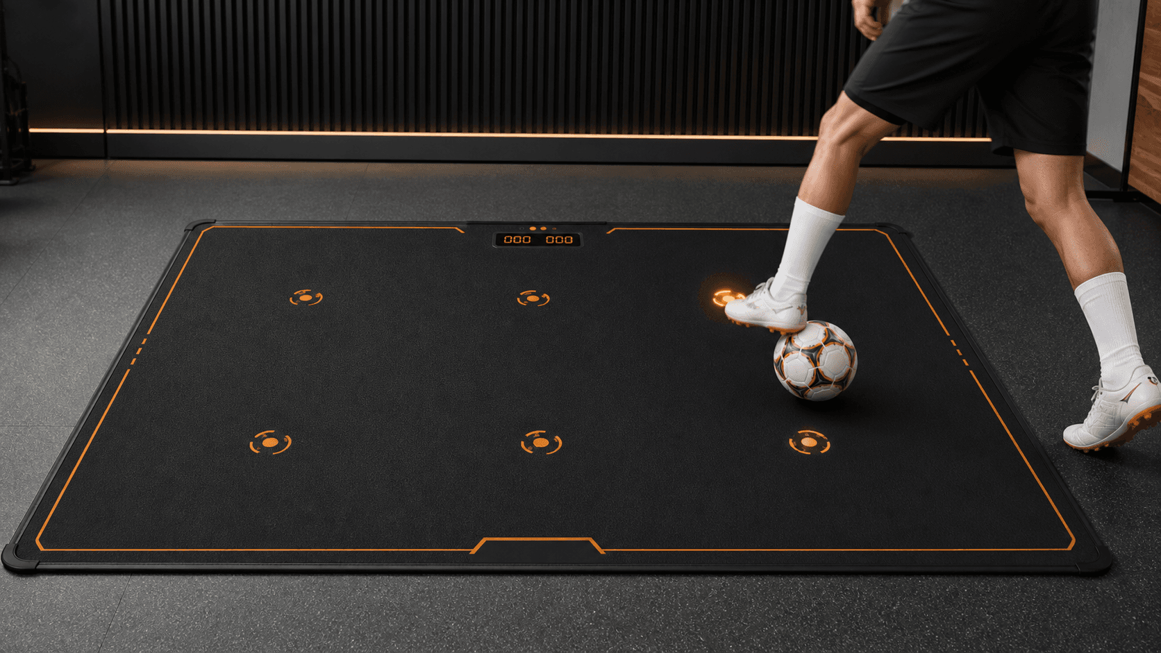 Soccer player using reaction lights with the ball on the STRK mat
