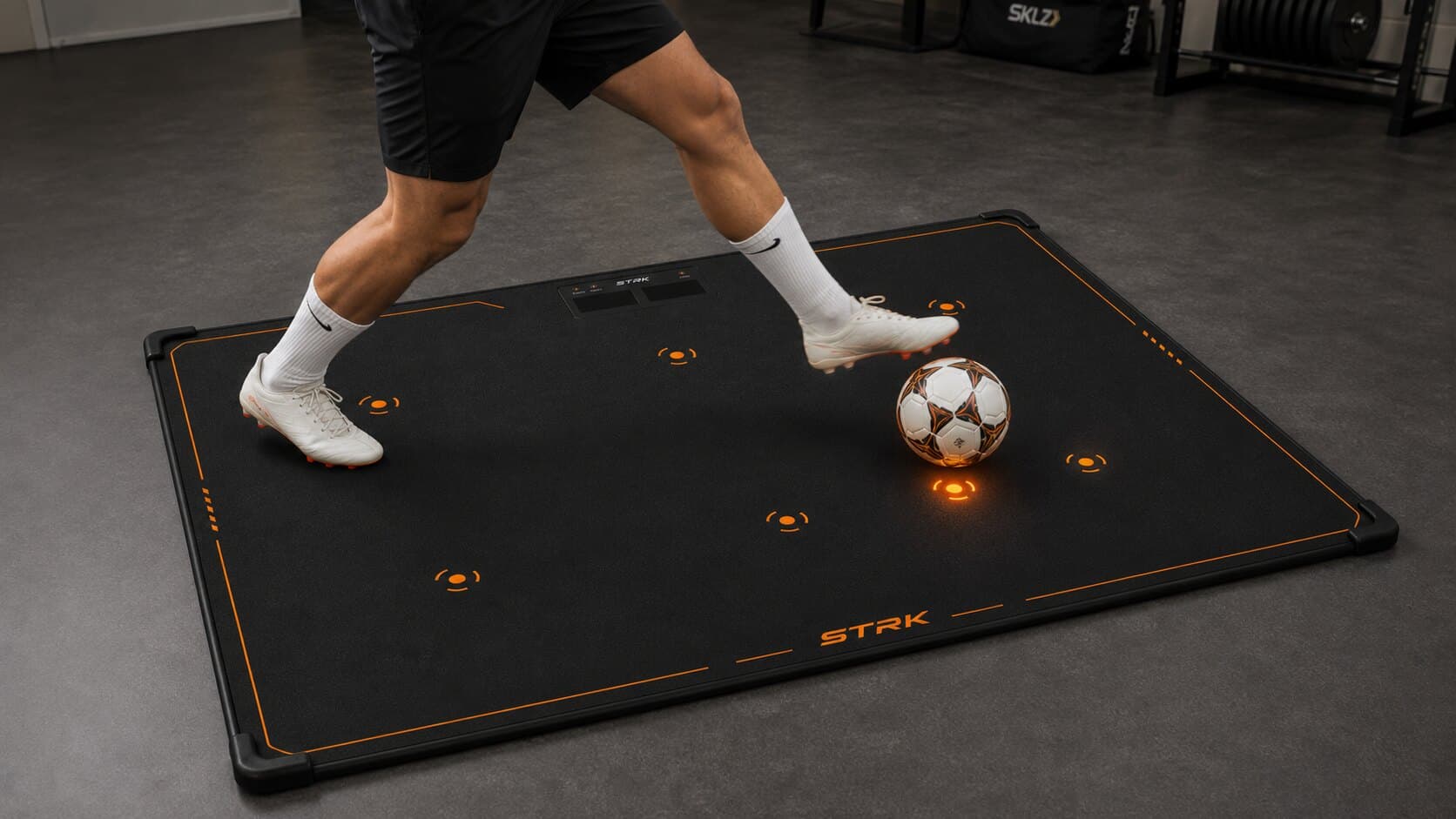 Soccer reaction training equipment with STRK mat light targets and ball control